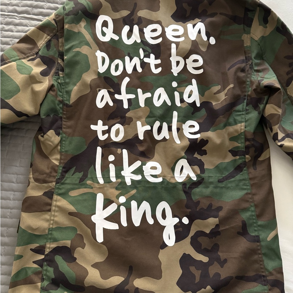 Camouflage Jacket with Bold White Text